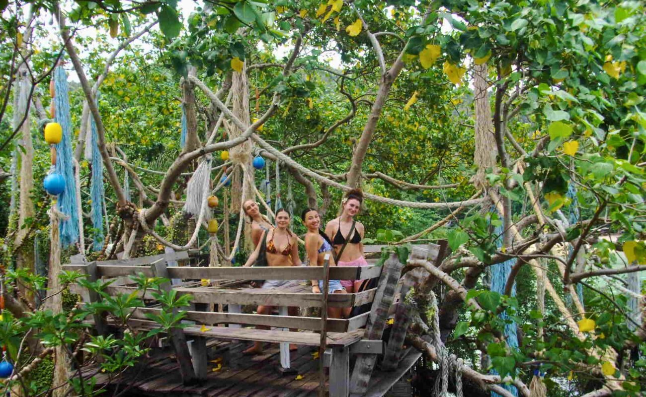 Thailand group tours stood in a treehouse structure